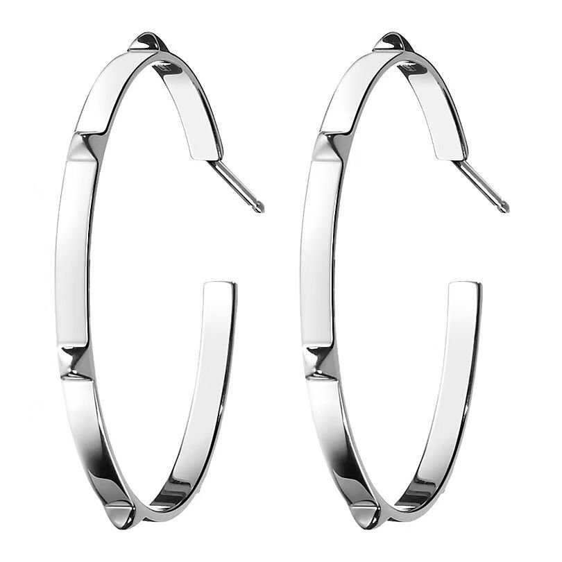 Orecchini Hermes Clou de Selle metallo argentato metallo tonalità oro rosa metallo tonalità oro giallo senza pietre preziose diametro 40 mm
