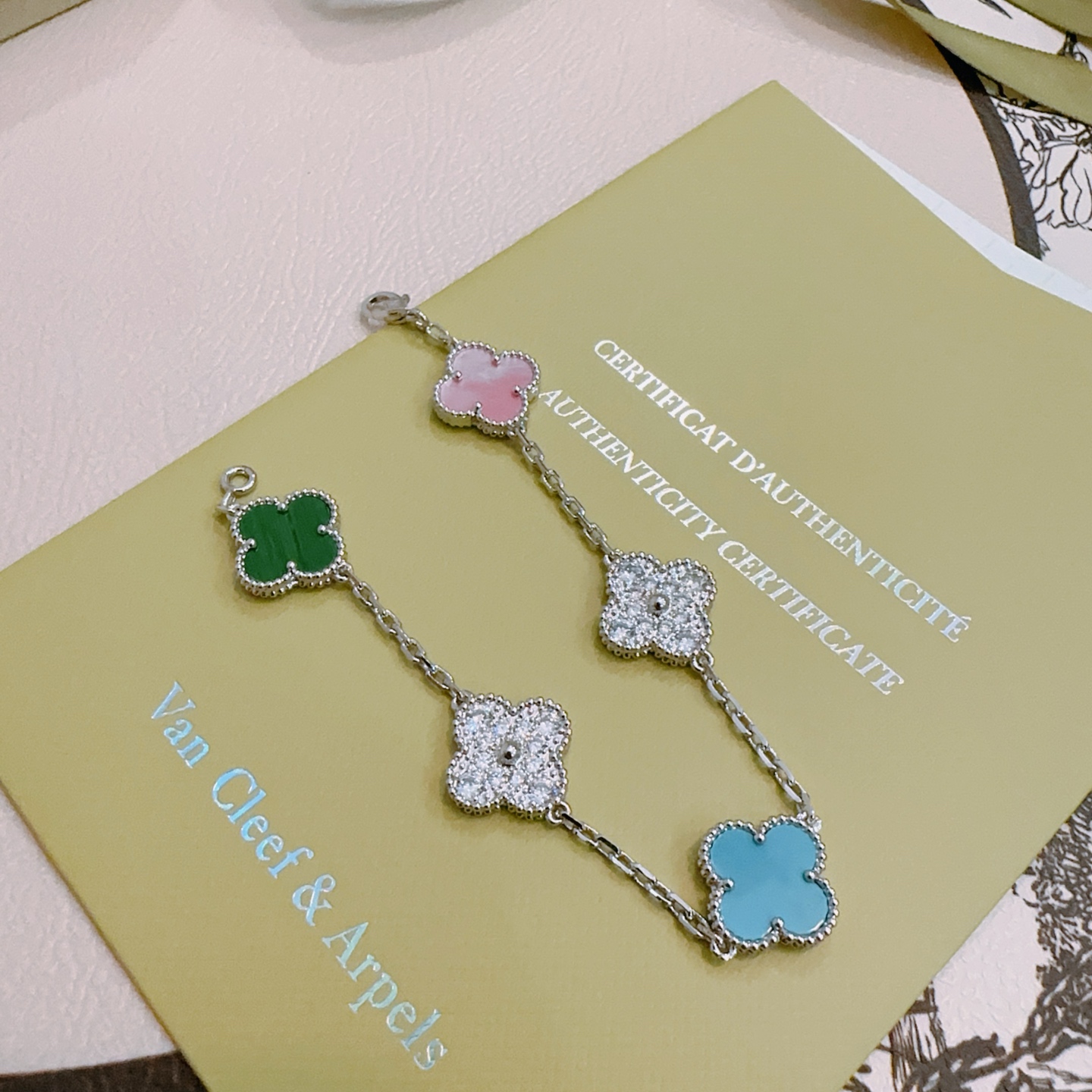 Van Cleef Arpels Alhambra bracelet Silver-toned metal with green malachite pink mother-of-pearl turquoise blue and clear diamond-accented four-leaf clover motifs 18cm