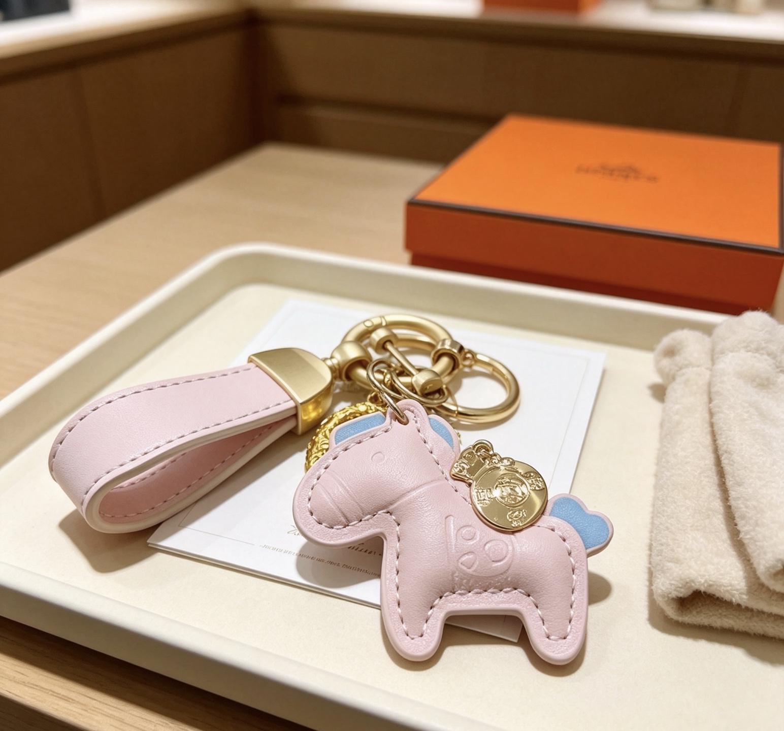 Hermes Rodeo Pony Key Charm pendant Light pink leather with light blue accents gold-tone metal hardware 12cm total length