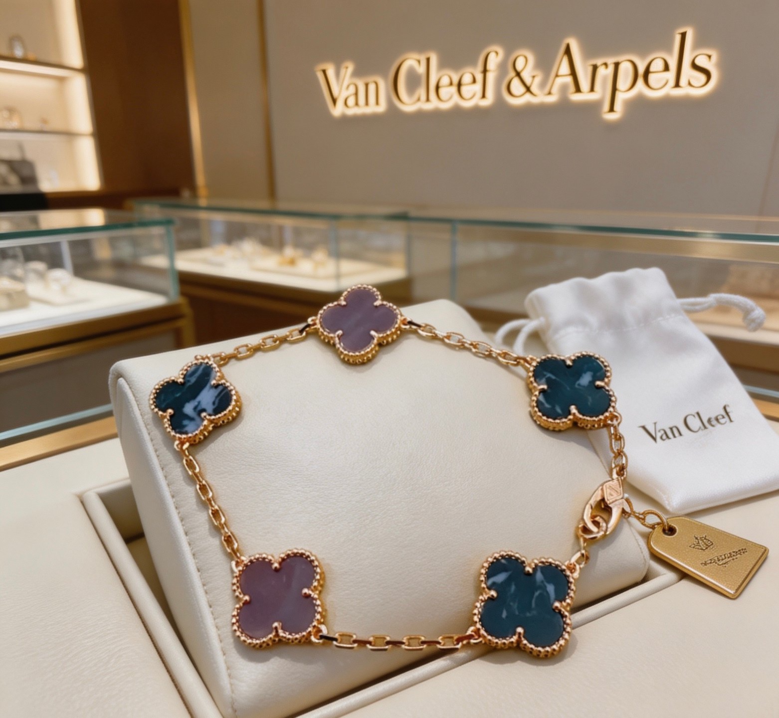 Van Cleef Arpels Vintage Alhambra bracelet Yellow gold metal with blue pietersite and purple chalcedony clover motifs 19cm
