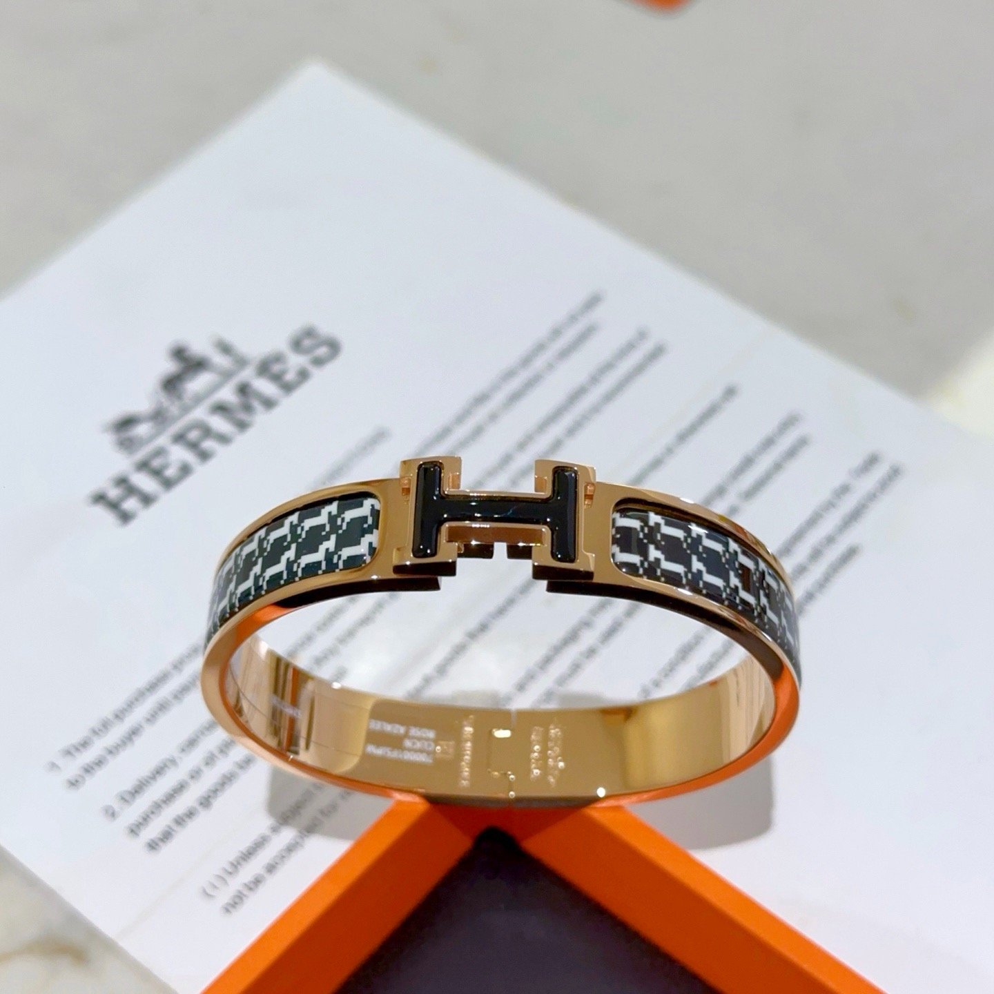 Hermes Clic H bracelet rose gold plated metal with black and white houndstooth enamel black enamel H clasp PM