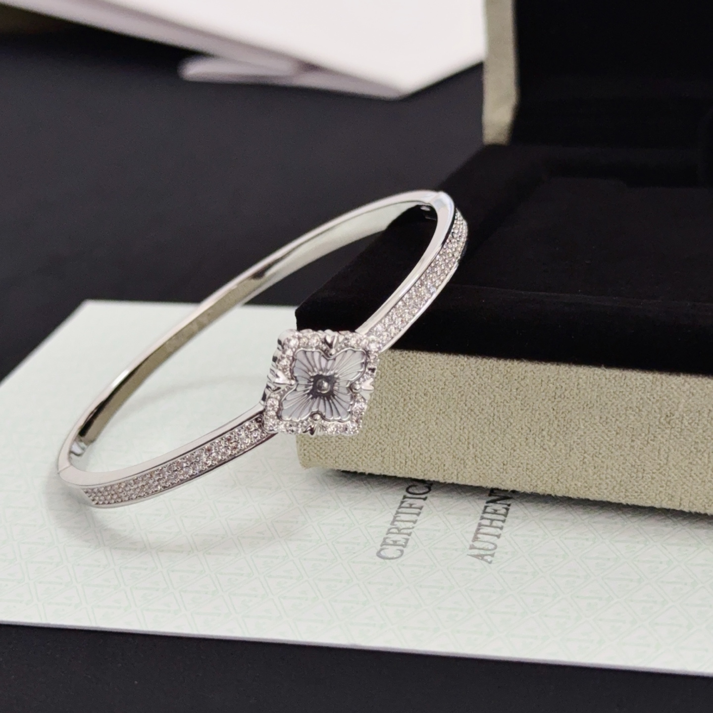 Van Cleef Arpels Alhambra bracelet silver-toned metal with clear diamond accents and grey engraved clover motif 17cm
