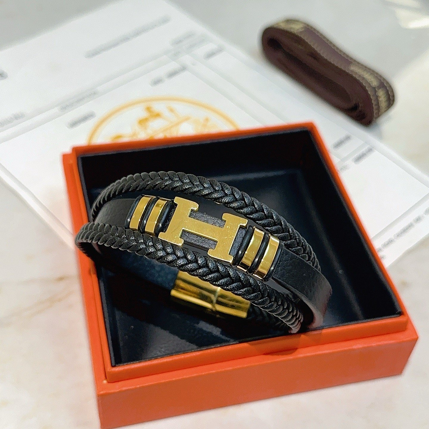 Bracciale Hermes New Anger Forest H Logo in pelle intrecciata nera hardware in metallo color oro 19 cm