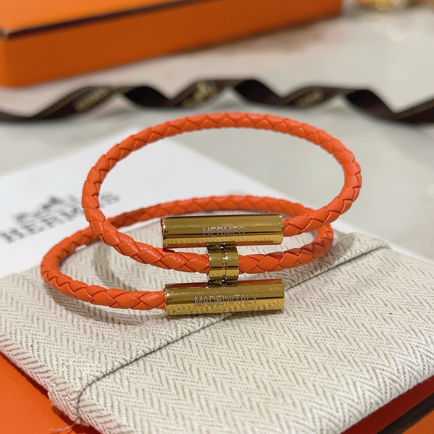 Hermes Tournis Tresse bracelet Orange braided leather with gold plated metal hardware 38cm double wrap