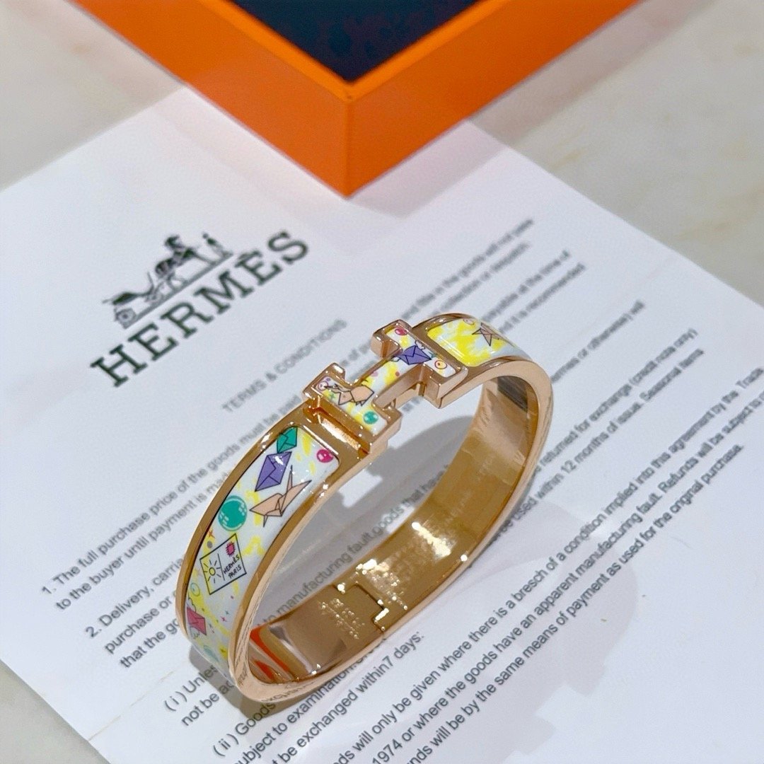 Pulseira Hermes Clic H Metal banhado a ouro rosa com esmalte branco e amarelo com estampa de origami multicolor PM