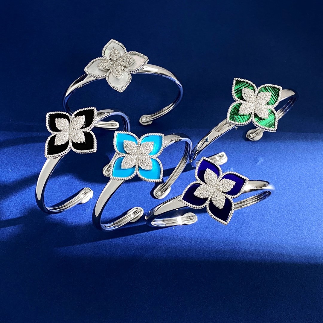 Van Cleef Arpels RC80 bracelet silver-toned metal with diamond-paved flower centers available with green malachite white mother-of-pearl black onyx turquoise blue and dark blue lapis lazuli petal inlays 17cm