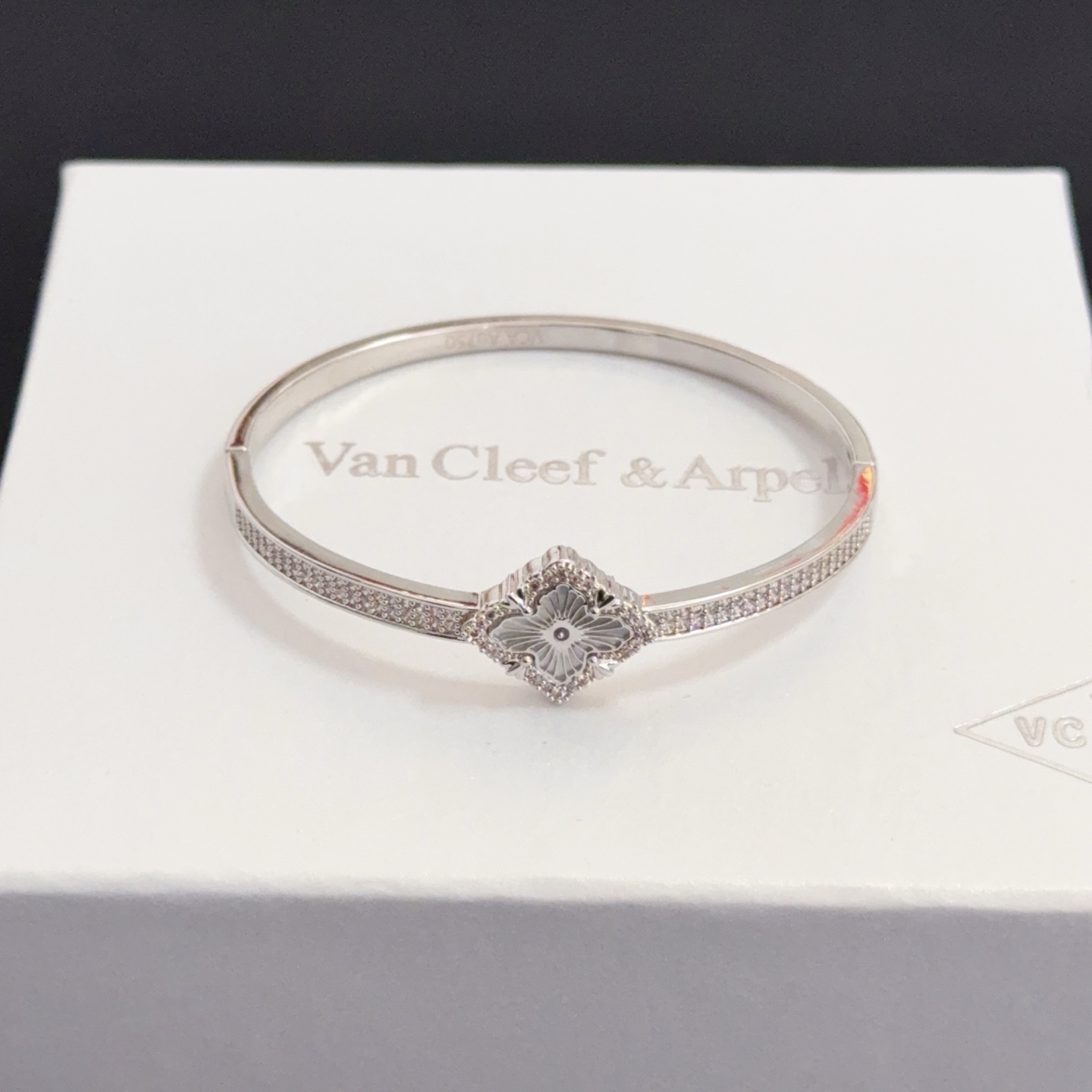 Van Cleef Arpels Alhambra bracelet silver-toned metal with clear diamond accents and silver guilloche clover motif 17cm