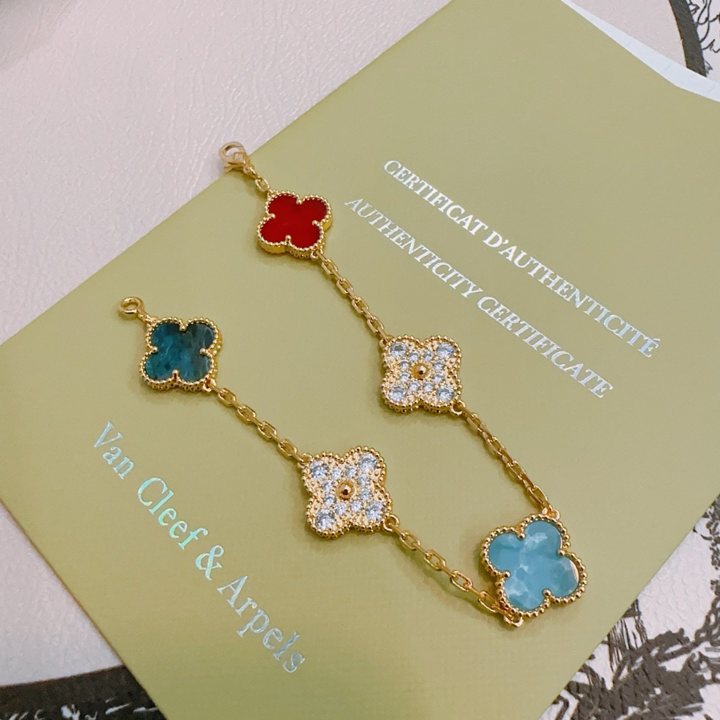 Van Cleef Arpels Alhambra bracelet Yellow gold with red carnelian sky blue turquoise teal blue apatite and clear diamond accents 17cm