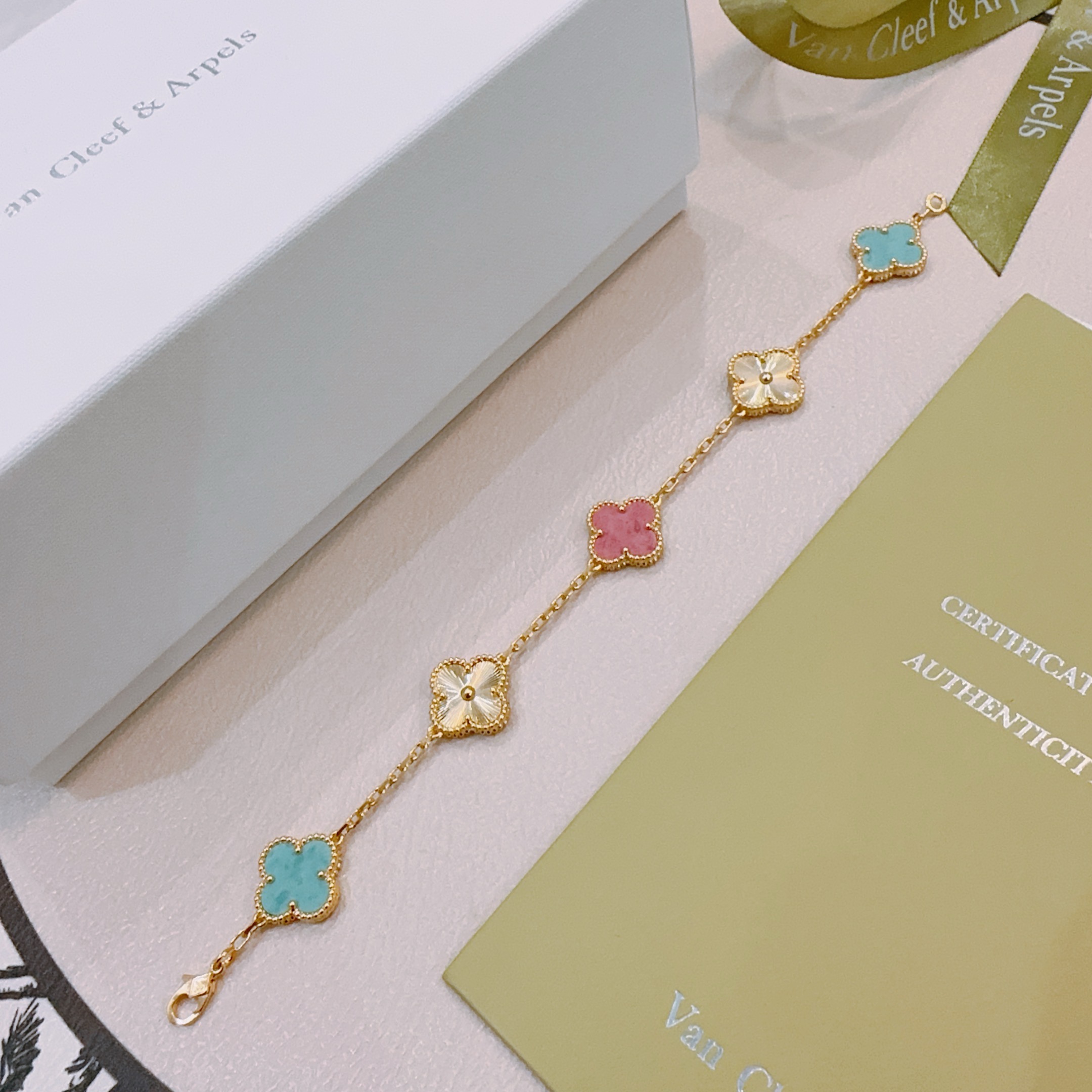 Van Cleef Arpels Alhambra bracelet Yellow gold metal with turquoise blue rhodonite pink and golden guilloche clover motifs 19cm