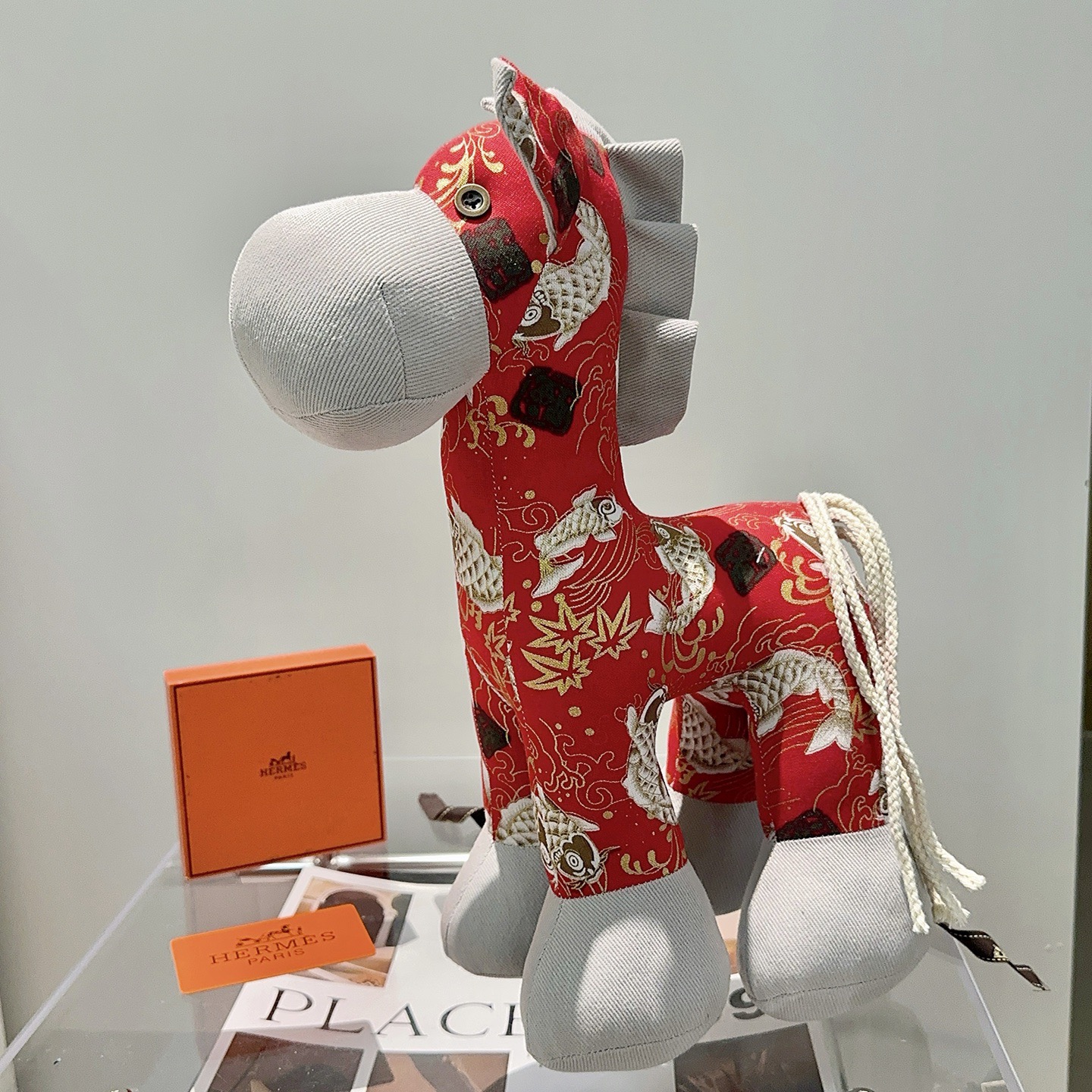 Hermes Rodeo Horse Charm pendant Red fabric with light gray fabric accents gold and white koi print off-white cord tail 35cm